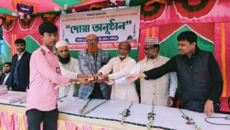 A prayer ceremony was held at Nekmamud Update Public School on the occasion of bidding farewell to the eighth-grade students and presenting the holy Quran's 'Sobok' to the fourth-grade students.